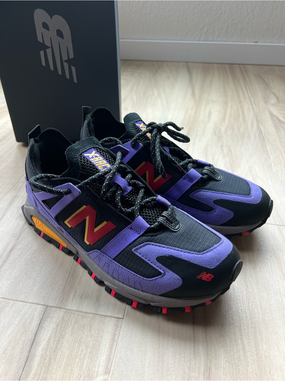 New Balance Men’s Black & Purple Trail Sneakers with Red & Orange Accents